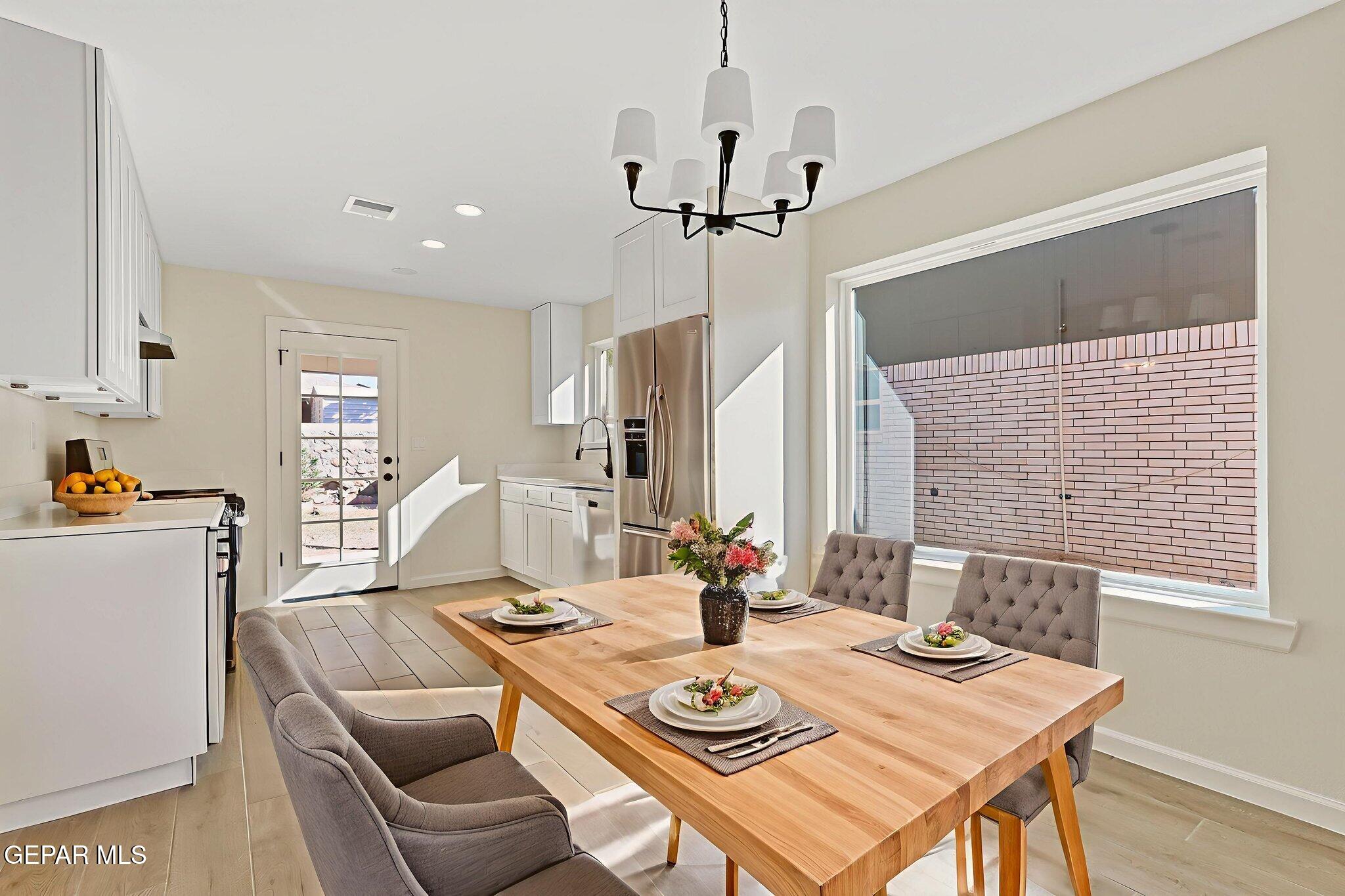 3428 Itasca Street El Paso, TX 79936 - Photo 9 of 34 a view of a dining room with furniture window and wooden floor