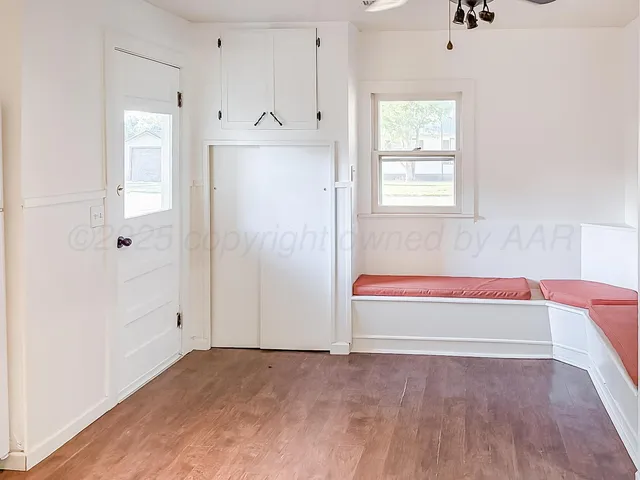 a view of an empty room with a window