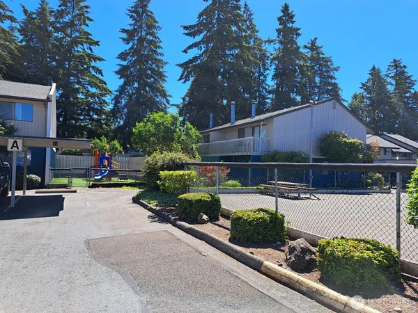 a view of a backyard with sitting area