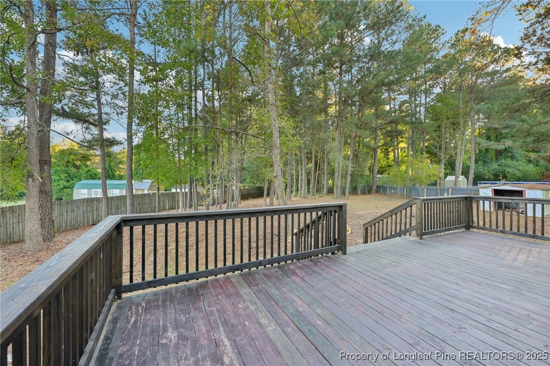 211 Lemuel Black Road Bunnlevel, NC 28323 - Photo 27 of 29 a view of deck with wooden floor and fence