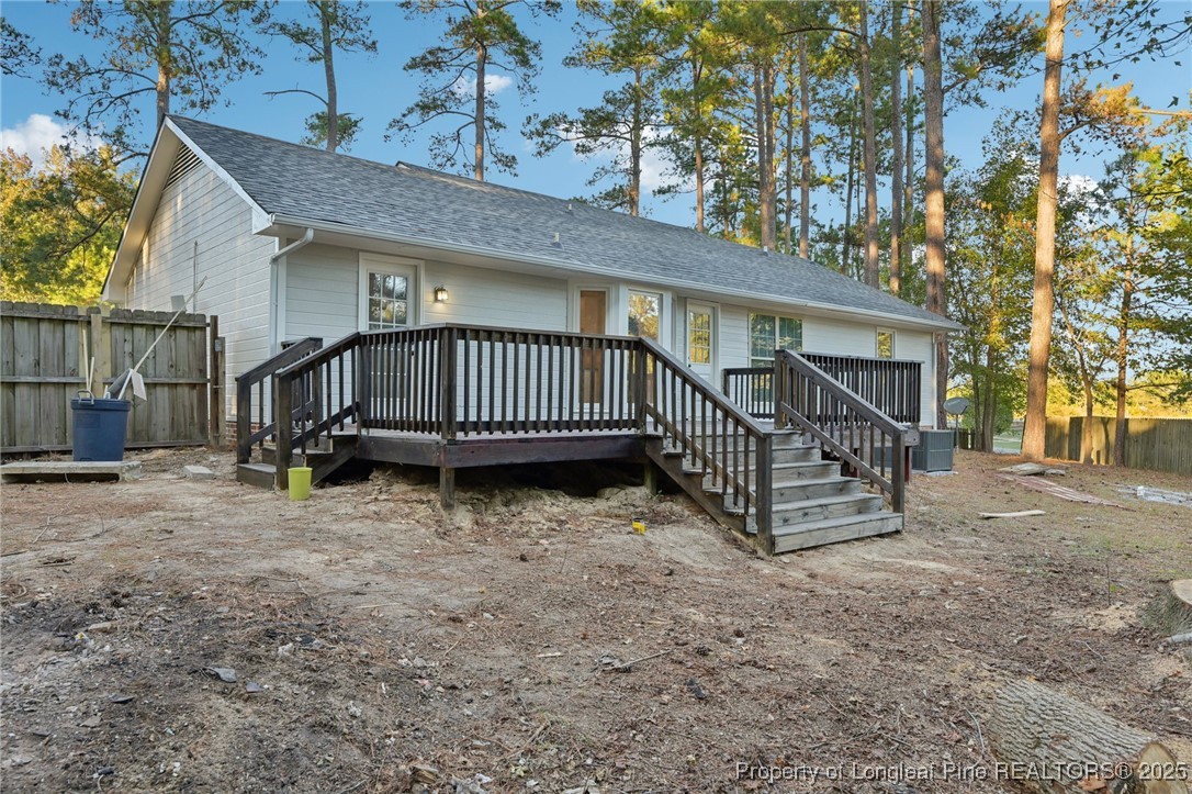 211 Lemuel Black Road Bunnlevel, NC 28323 - Photo 29 of 29 a view of a house with a yard and wooden fence