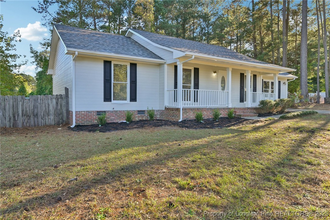 211 Lemuel Black Road Bunnlevel, NC 28323 - Photo 3 of 29 a front view of a house with a yard