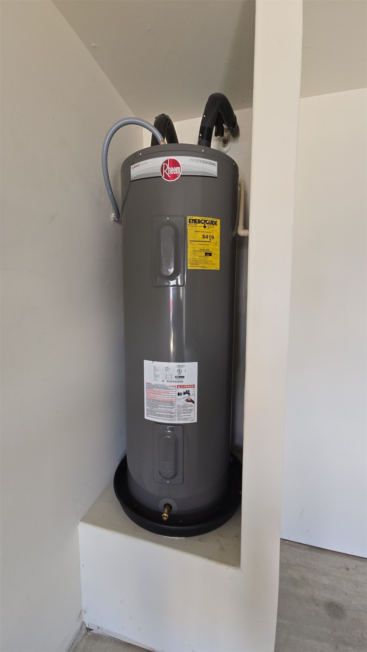 19808 Hubert R Humphrey Road Manor, TX 78653 - Photo 5 of 37 A modern electric water heater is neatly installed in a dedicated utility alcove.