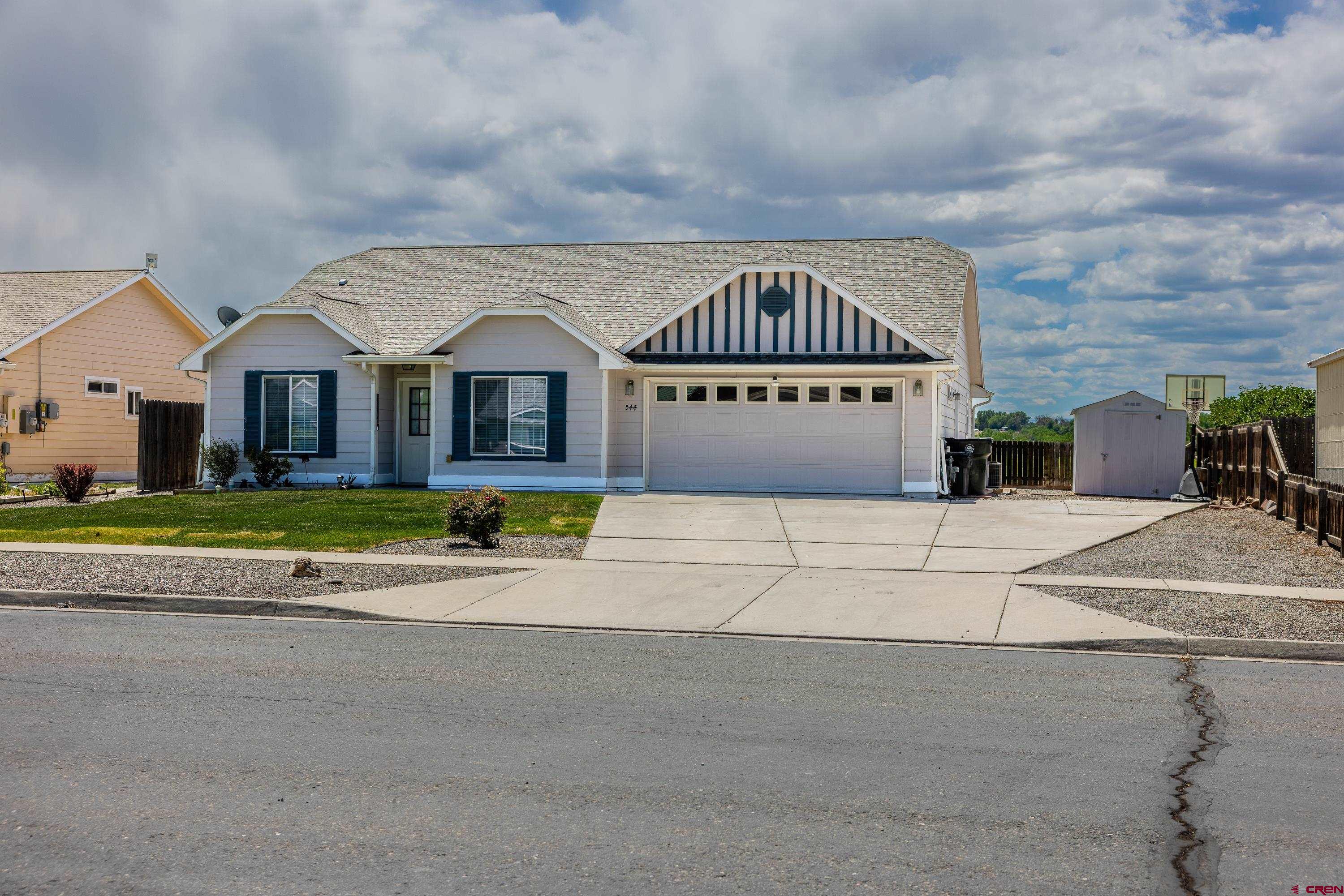 544 20th Street Delta, CO 81416 - Photo 2 of 44 a view of a house with a yard in front of it