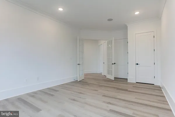 a kitchen with stainless steel appliances a refrigerator and a stove top oven