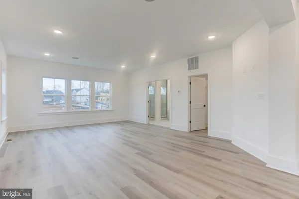 a view of a hallway with seating area