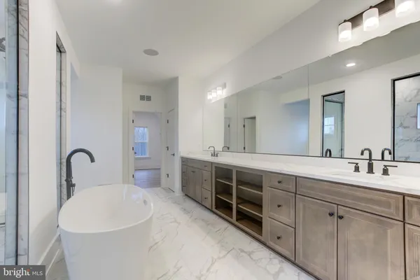 a view of a house with backyard and trees