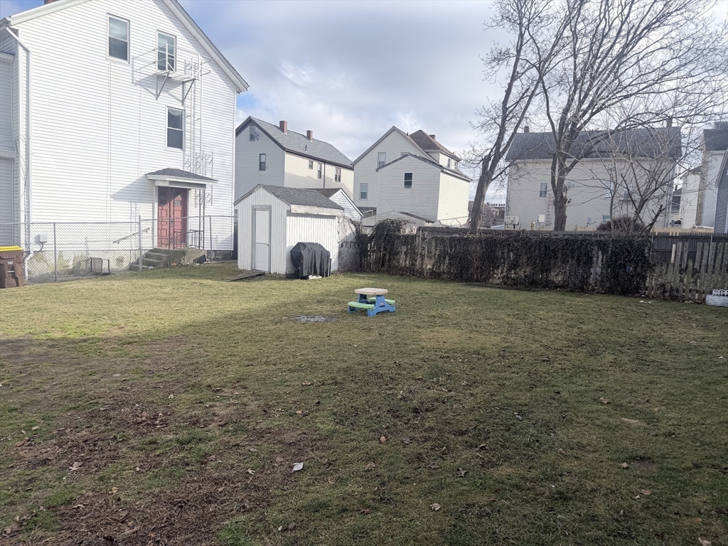1852 South Main Street Fall River, MA 02724 - Photo 3 of 21 a backyard of a house with lots of green space