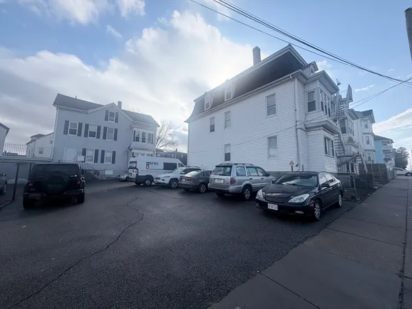 a view of street with parked cars
