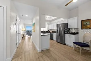 a kitchen with stainless steel appliances a refrigerator and a stove top oven