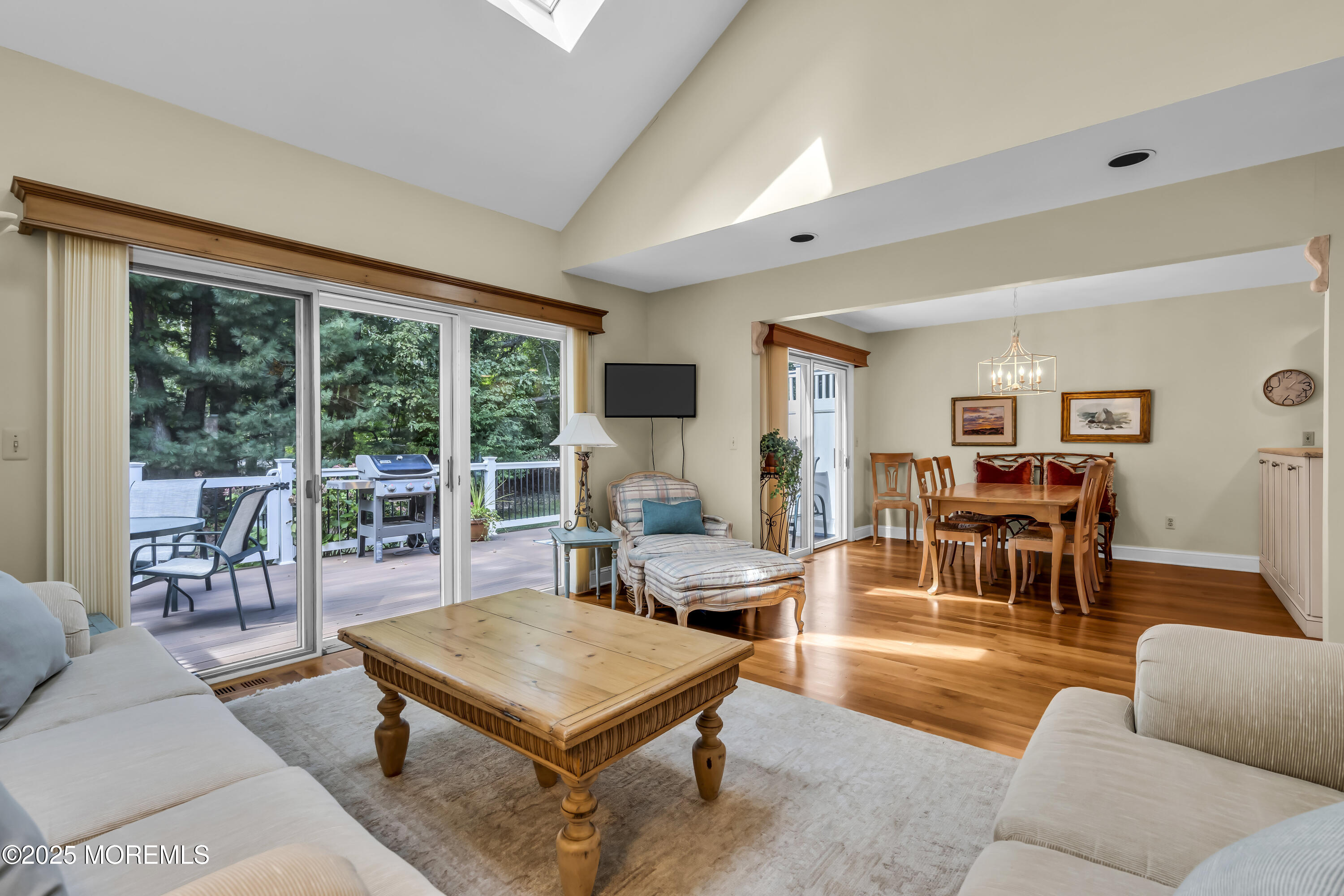 1301 Warren Avenue, Unit 5 Spring Lake, NJ 07762 - Photo 13 of 51 a living room with furniture a table and a large window