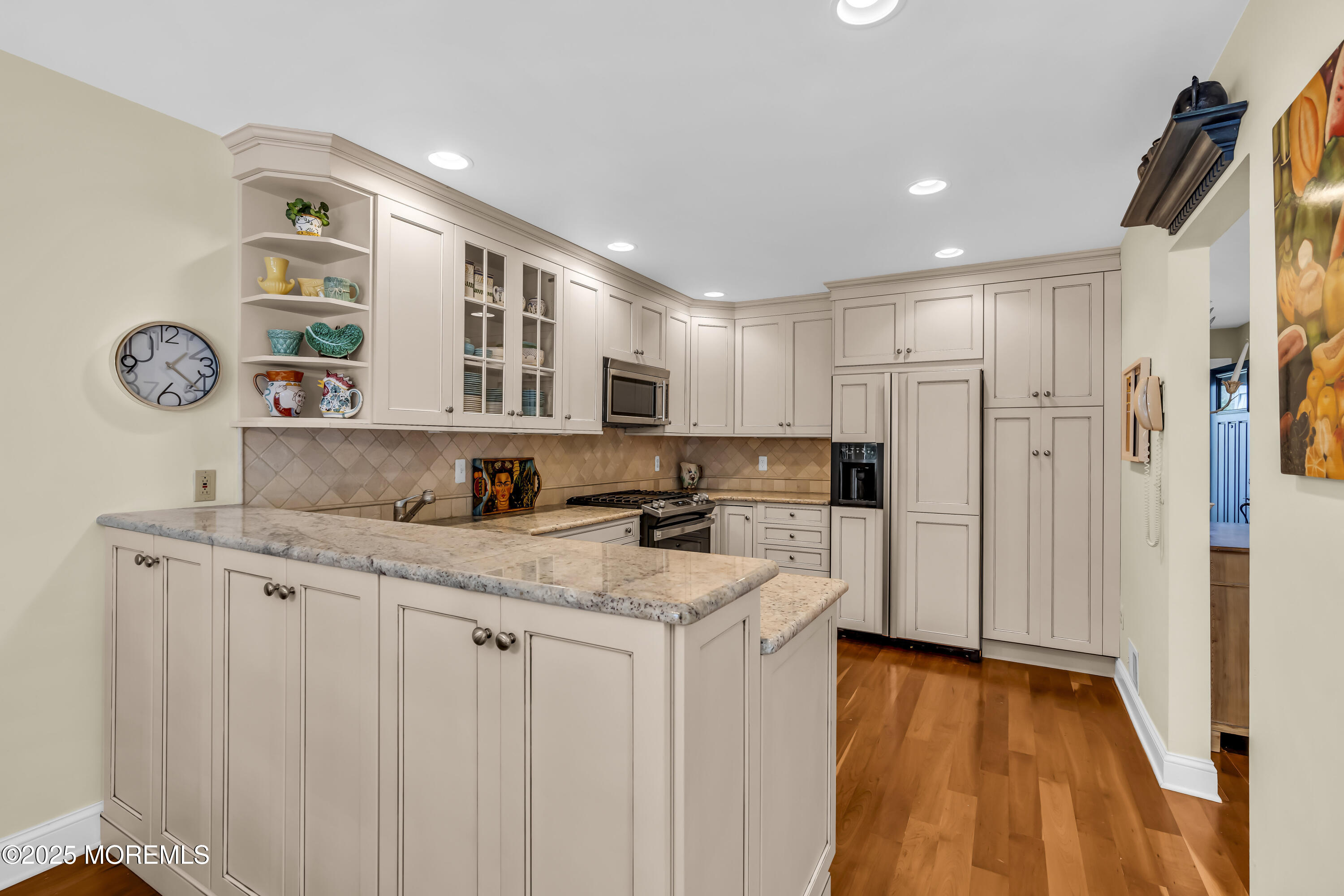1301 Warren Avenue, Unit 5 Spring Lake, NJ 07762 - Photo 18 of 51 a kitchen with stainless steel appliances granite countertop a sink and cabinets