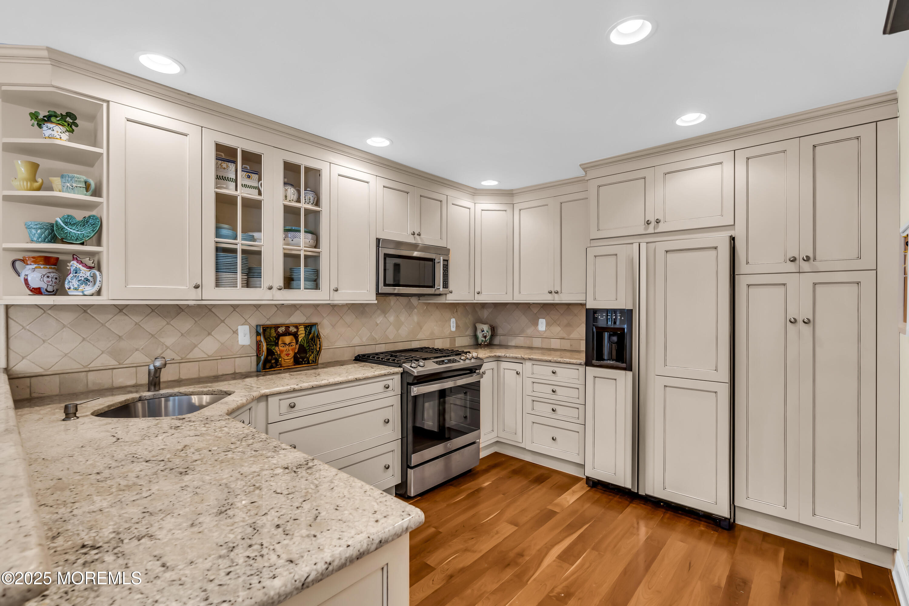 1301 Warren Avenue, Unit 5 Spring Lake, NJ 07762 - Photo 19 of 51 a kitchen with granite countertop white cabinets and white appliances