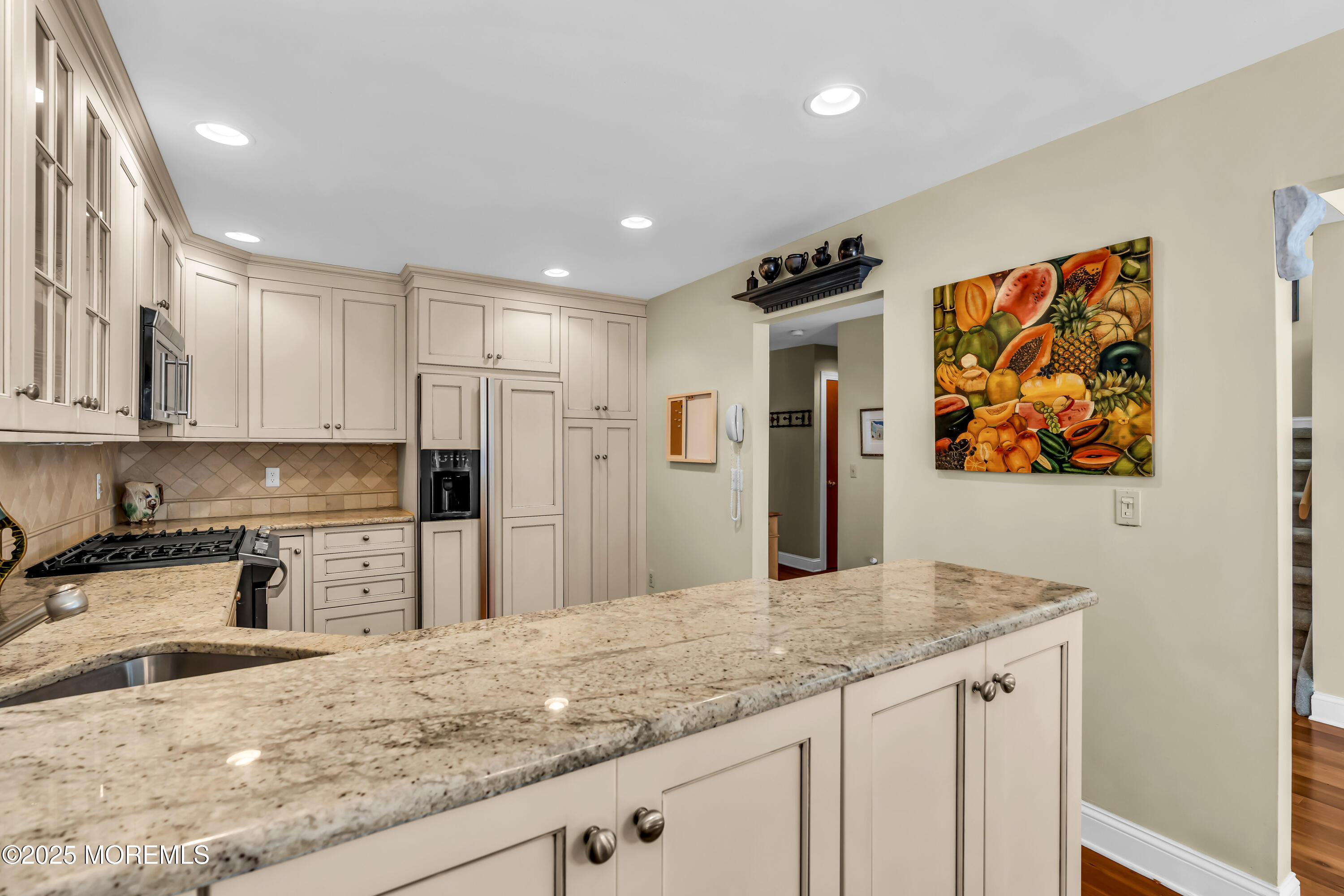 1301 Warren Avenue, Unit 5 Spring Lake, NJ 07762 - Photo 20 of 51 a kitchen with stainless steel appliances granite countertop a sink and cabinets