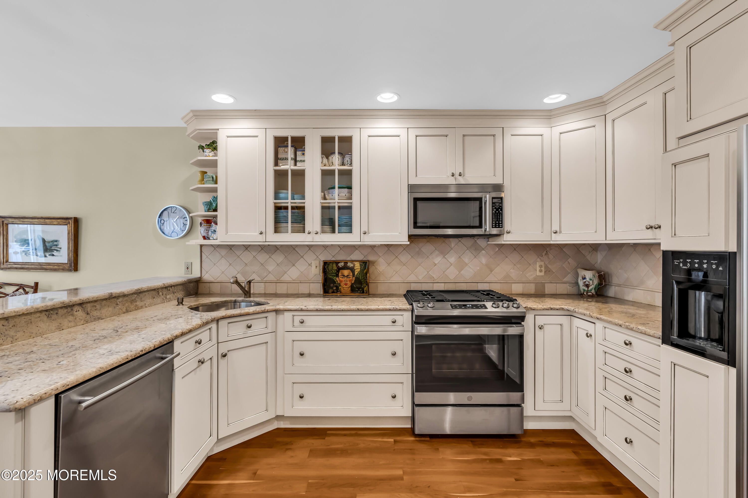 1301 Warren Avenue, Unit 5 Spring Lake, NJ 07762 - Photo 21 of 51 a kitchen with granite countertop white cabinets and stainless steel appliances