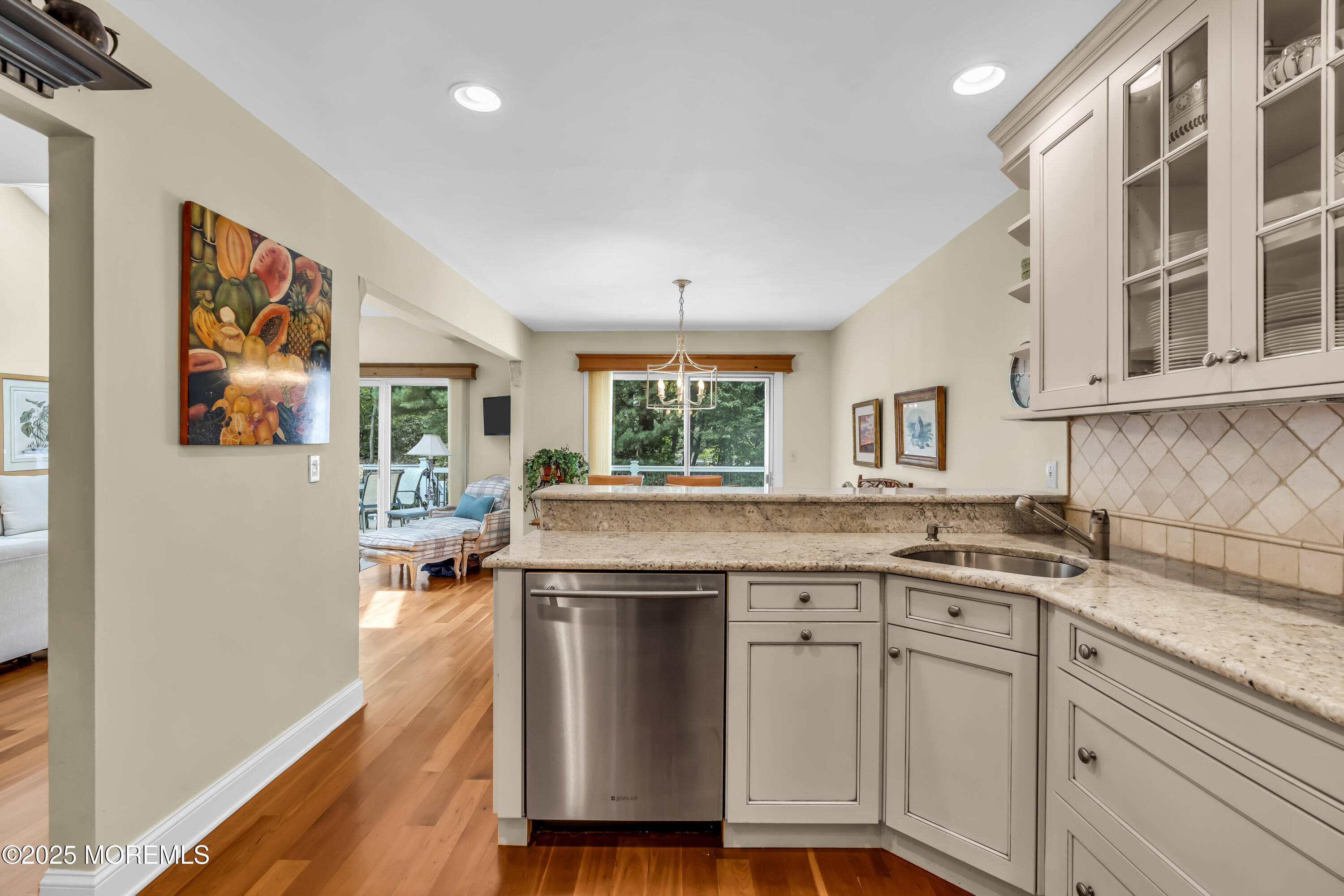 1301 Warren Avenue, Unit 5 Spring Lake, NJ 07762 - Photo 22 of 51 a kitchen with a sink cabinets and wooden floor