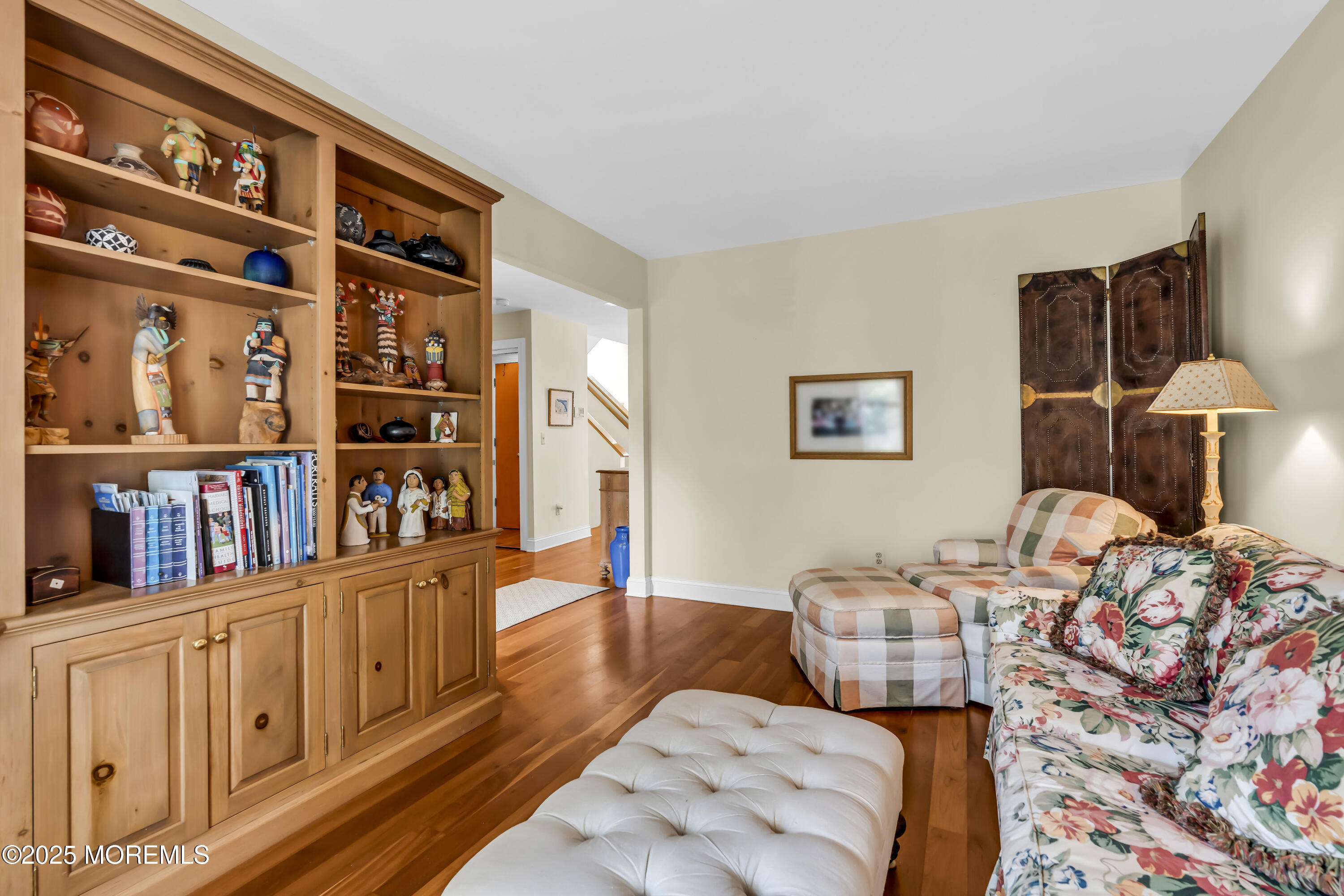 1301 Warren Avenue, Unit 5 Spring Lake, NJ 07762 - Photo 24 of 51 a bedroom with furniture and a book shelf