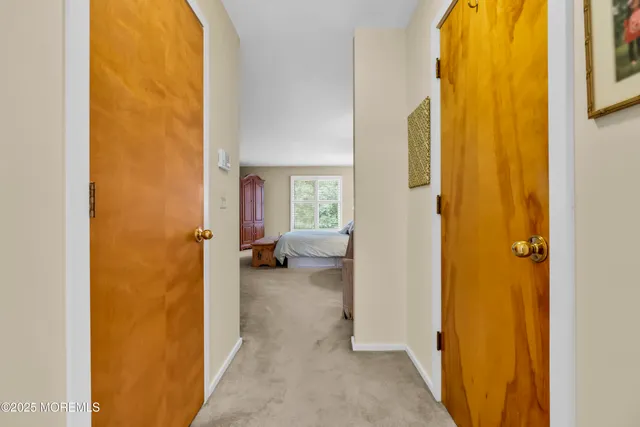 a view of a bedroom from a corridor