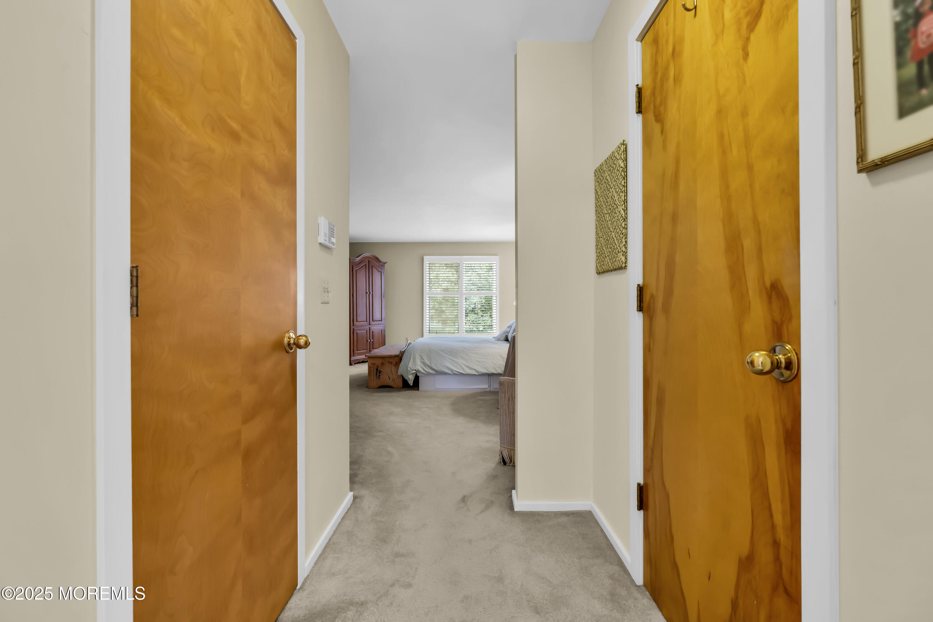 1301 Warren Avenue, Unit 5 Spring Lake, NJ 07762 - Photo 30 of 51 a view of a bedroom from a corridor