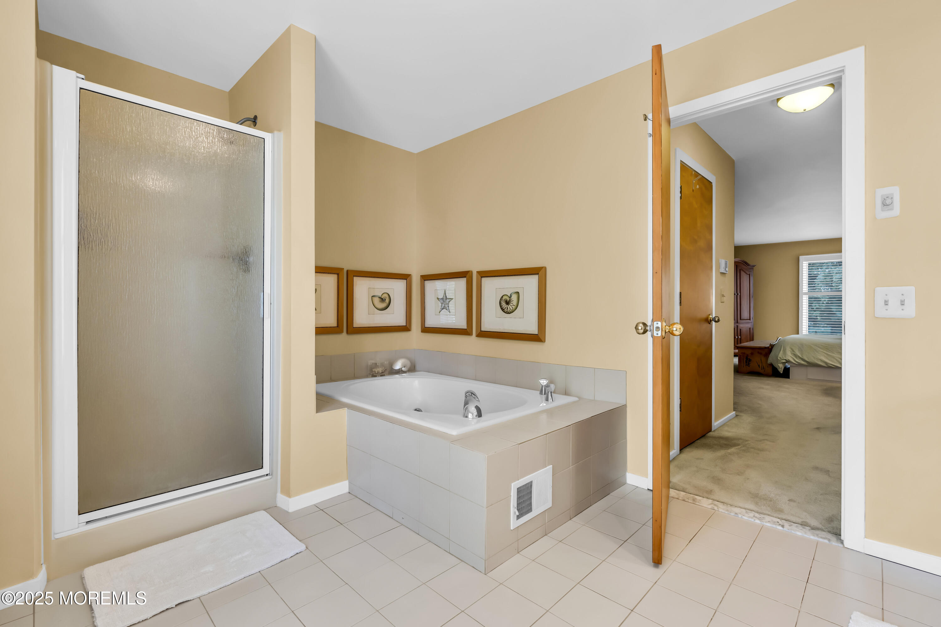 1301 Warren Avenue, Unit 5 Spring Lake, NJ 07762 - Photo 34 of 51 a spacious bathroom with a tub shower and mirror