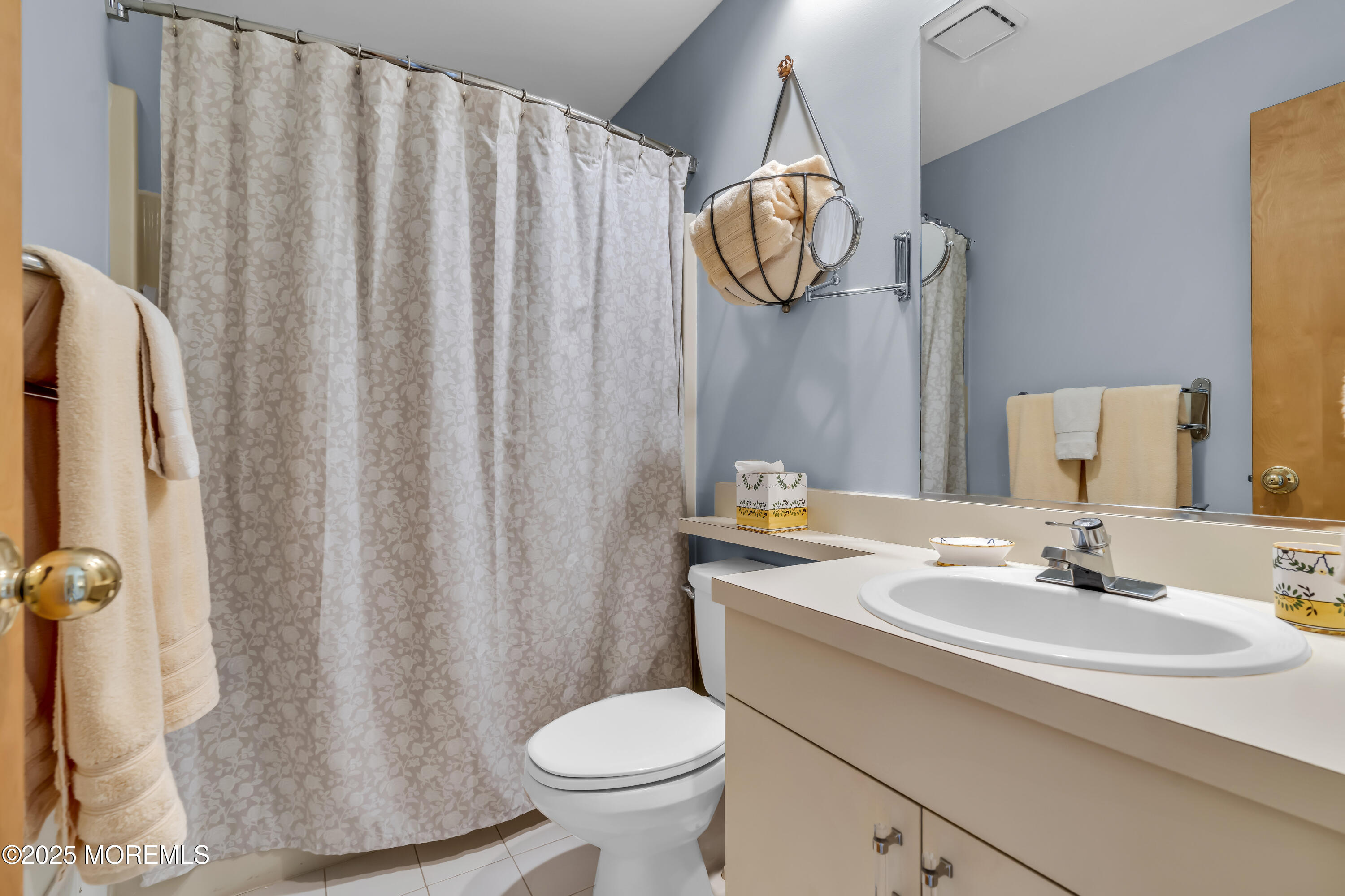 1301 Warren Avenue, Unit 5 Spring Lake, NJ 07762 - Photo 39 of 51 a bathroom with a sink a toilet and shower curtain