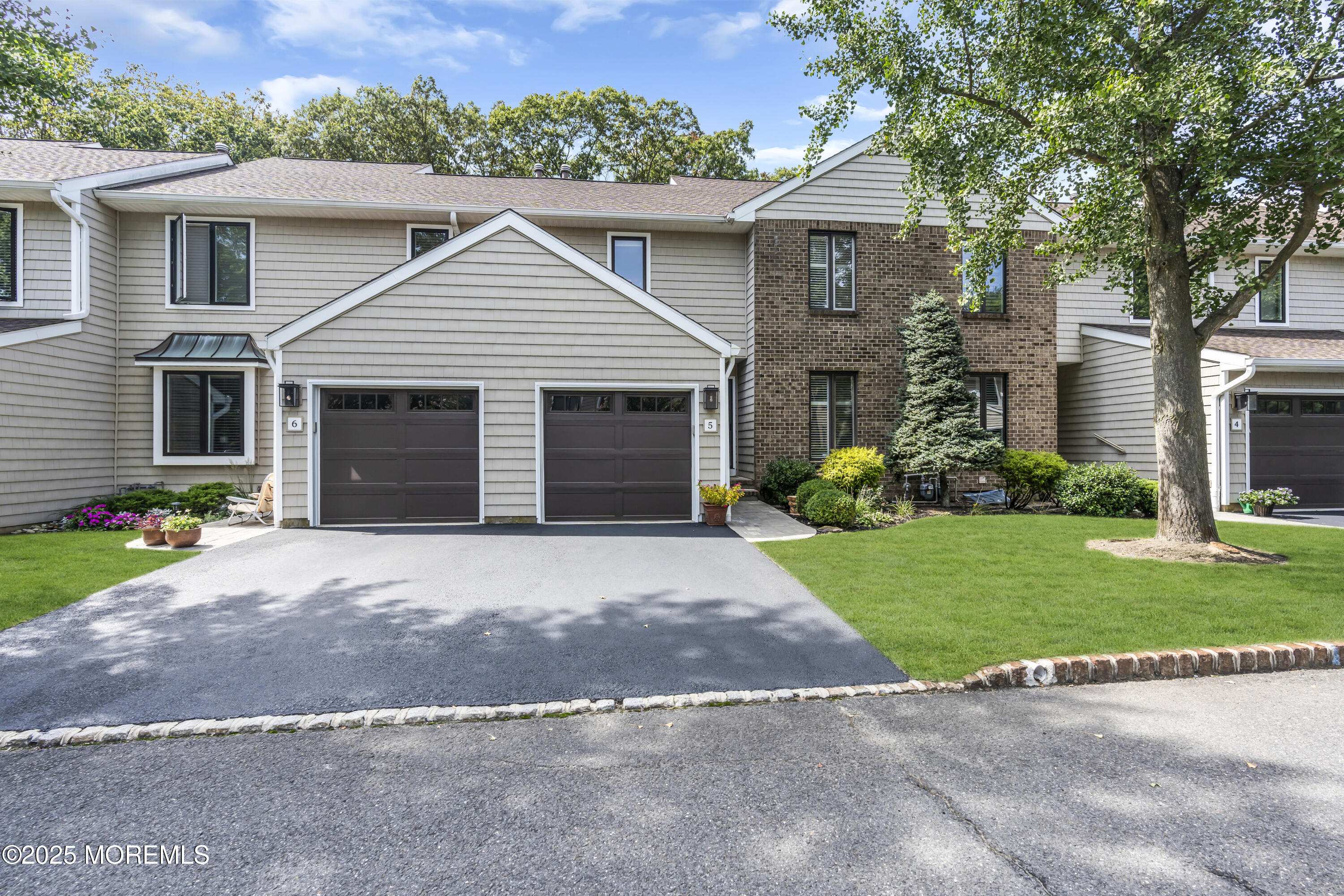 1301 Warren Avenue, Unit 5 Spring Lake, NJ 07762 - Photo 4 of 51 a view of a house with a yard and large tree