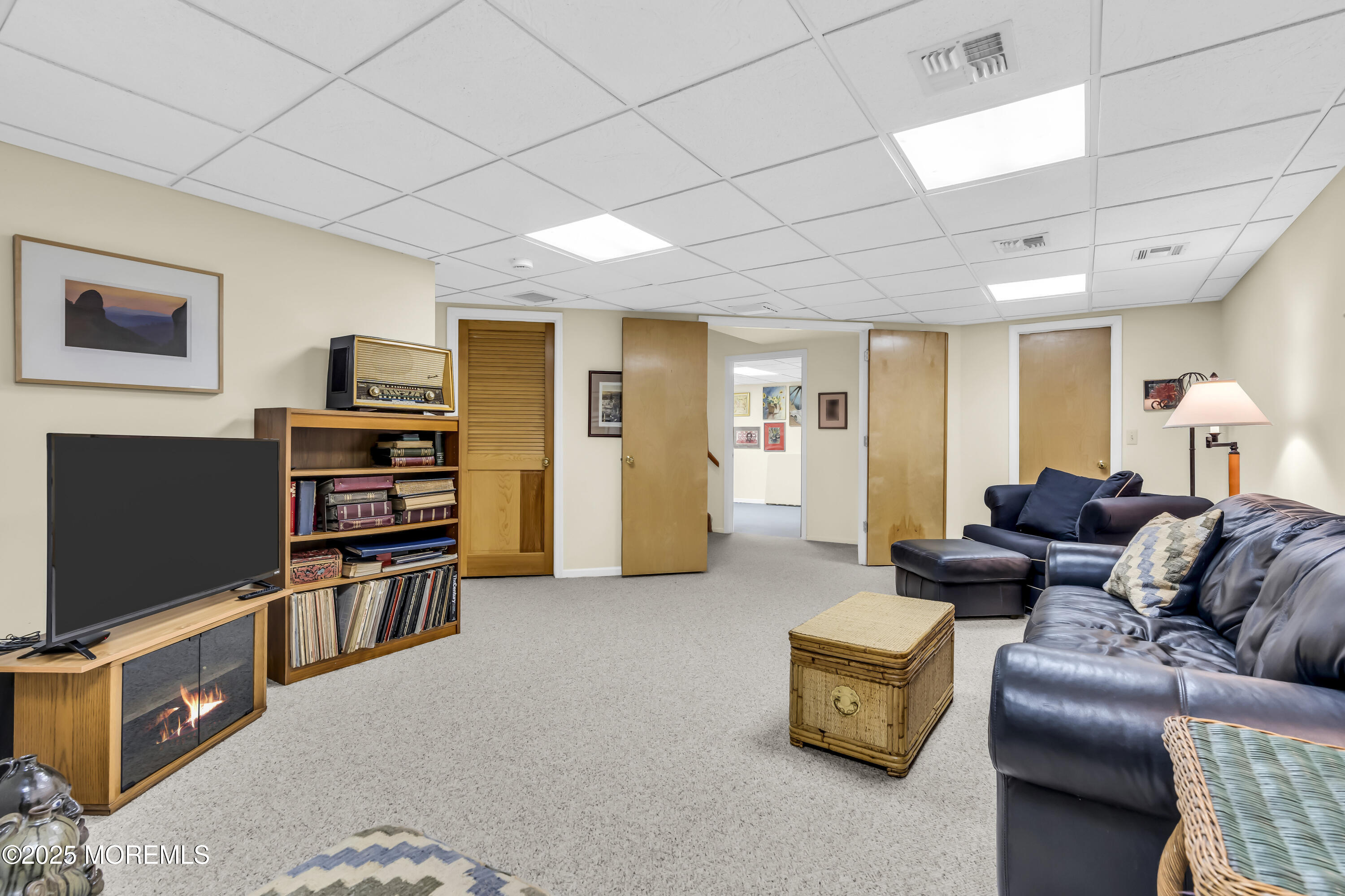 1301 Warren Avenue, Unit 5 Spring Lake, NJ 07762 - Photo 41 of 51 a living room with furniture and a flat screen tv