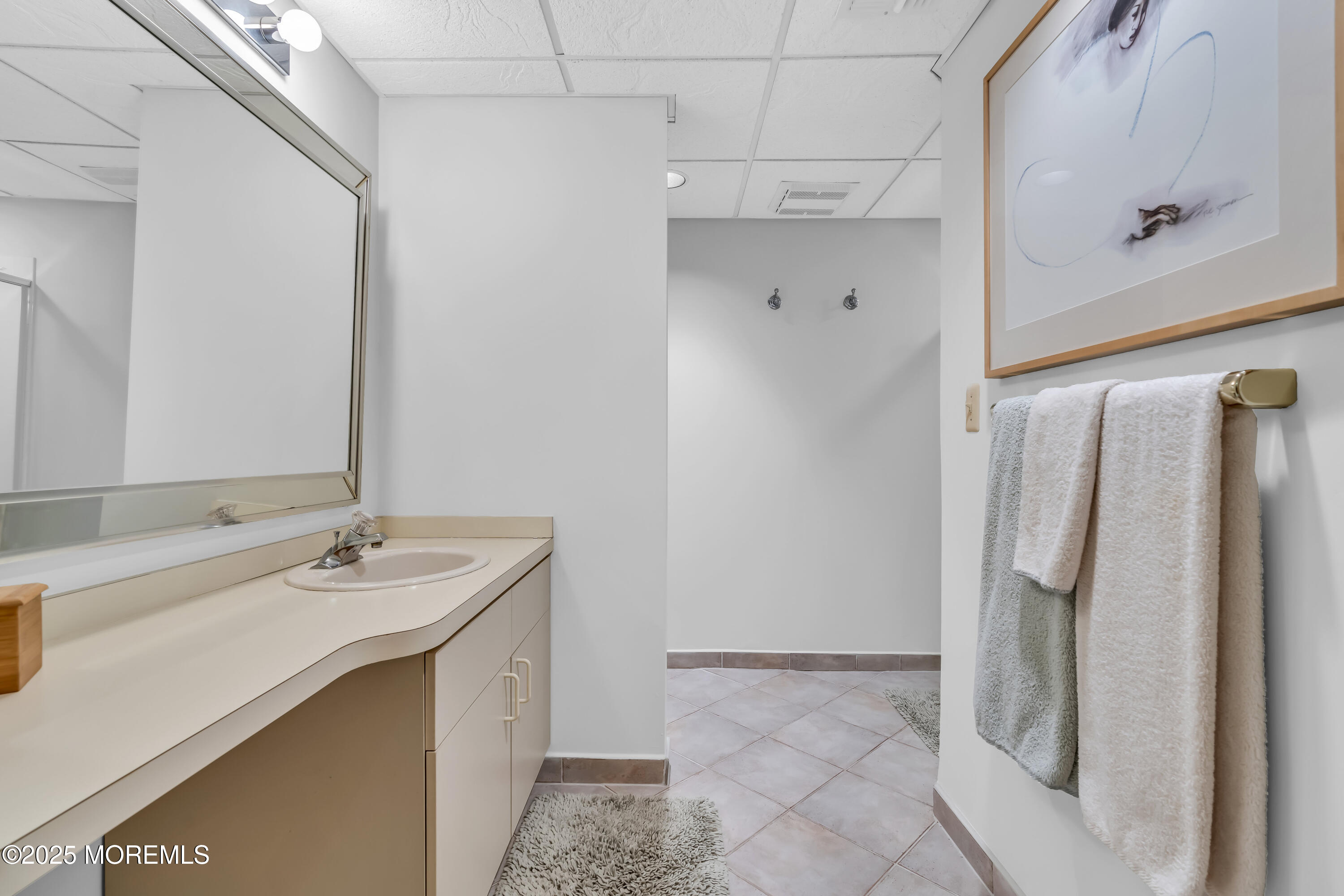 1301 Warren Avenue, Unit 5 Spring Lake, NJ 07762 - Photo 42 of 51 a bathroom with a sink vanity and a mirror