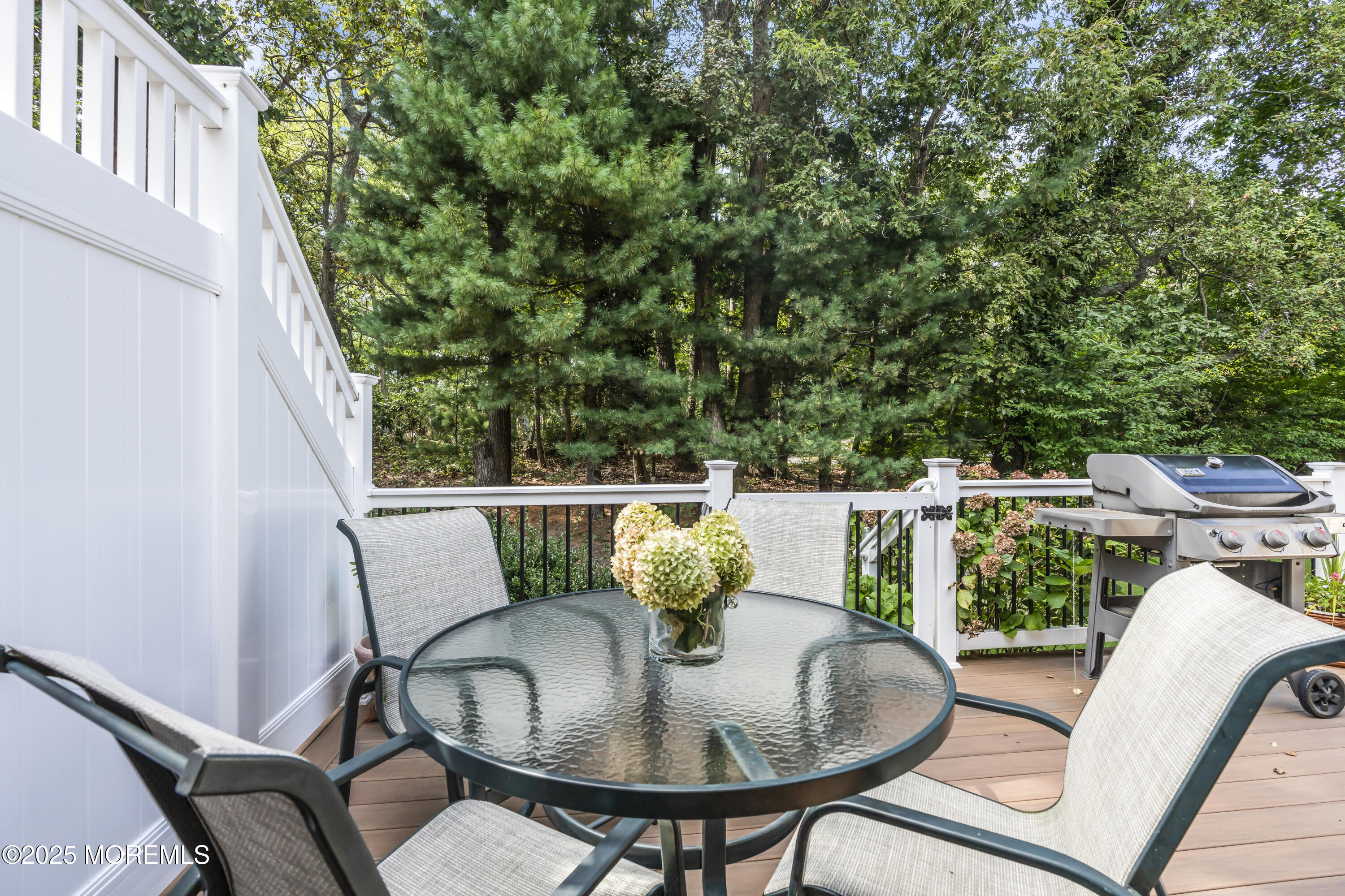 1301 Warren Avenue, Unit 5 Spring Lake, NJ 07762 - Photo 47 of 51 a balcony with a table and chairs