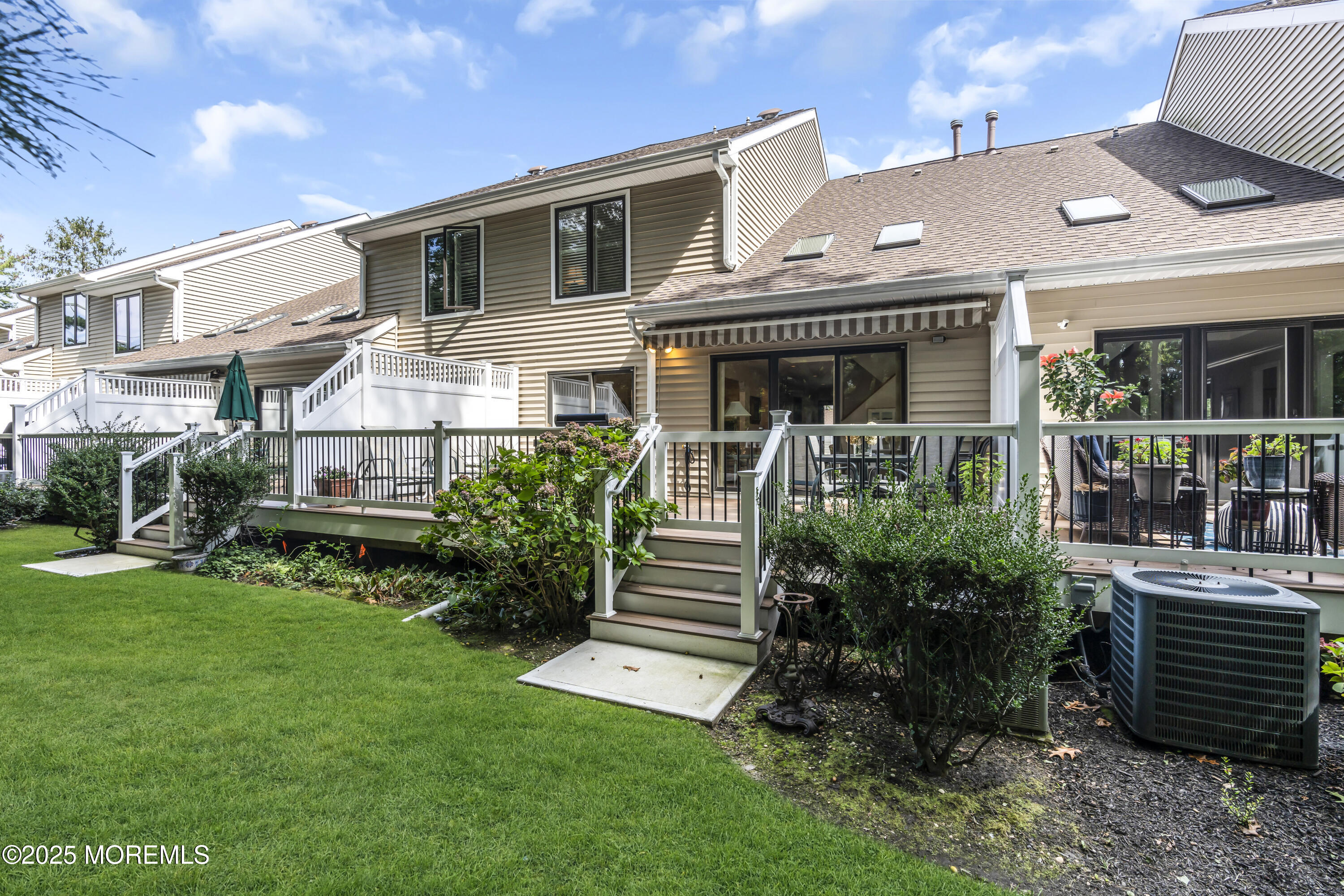 1301 Warren Avenue, Unit 5 Spring Lake, NJ 07762 - Photo 49 of 51 a front view of a house with garden