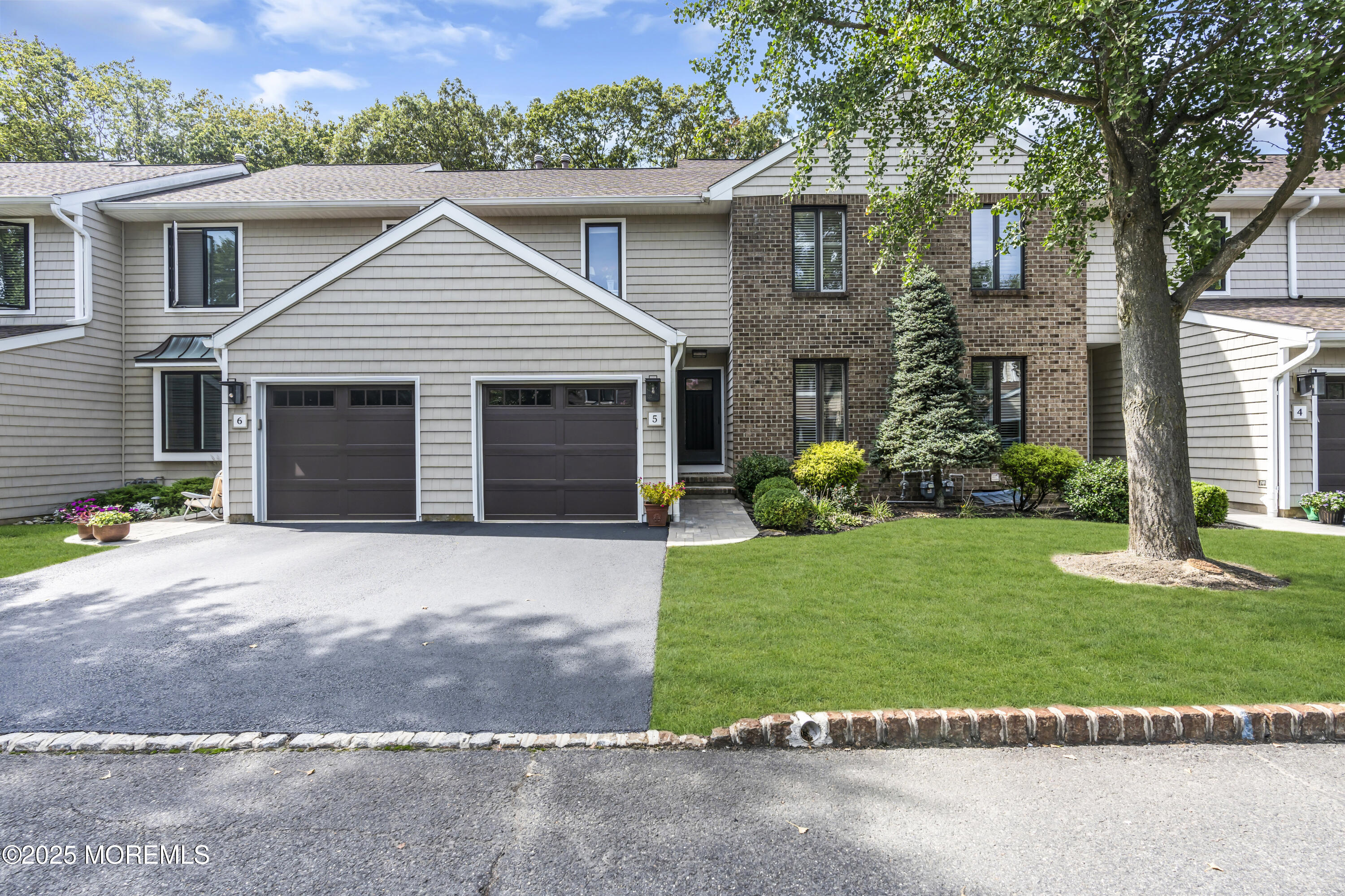 1301 Warren Avenue, Unit 5 Spring Lake, NJ 07762 - Photo 51 of 51 a view of a house with garden and yard