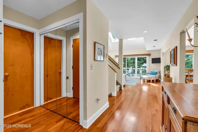 a very nice looking room with a large window and wooden floor