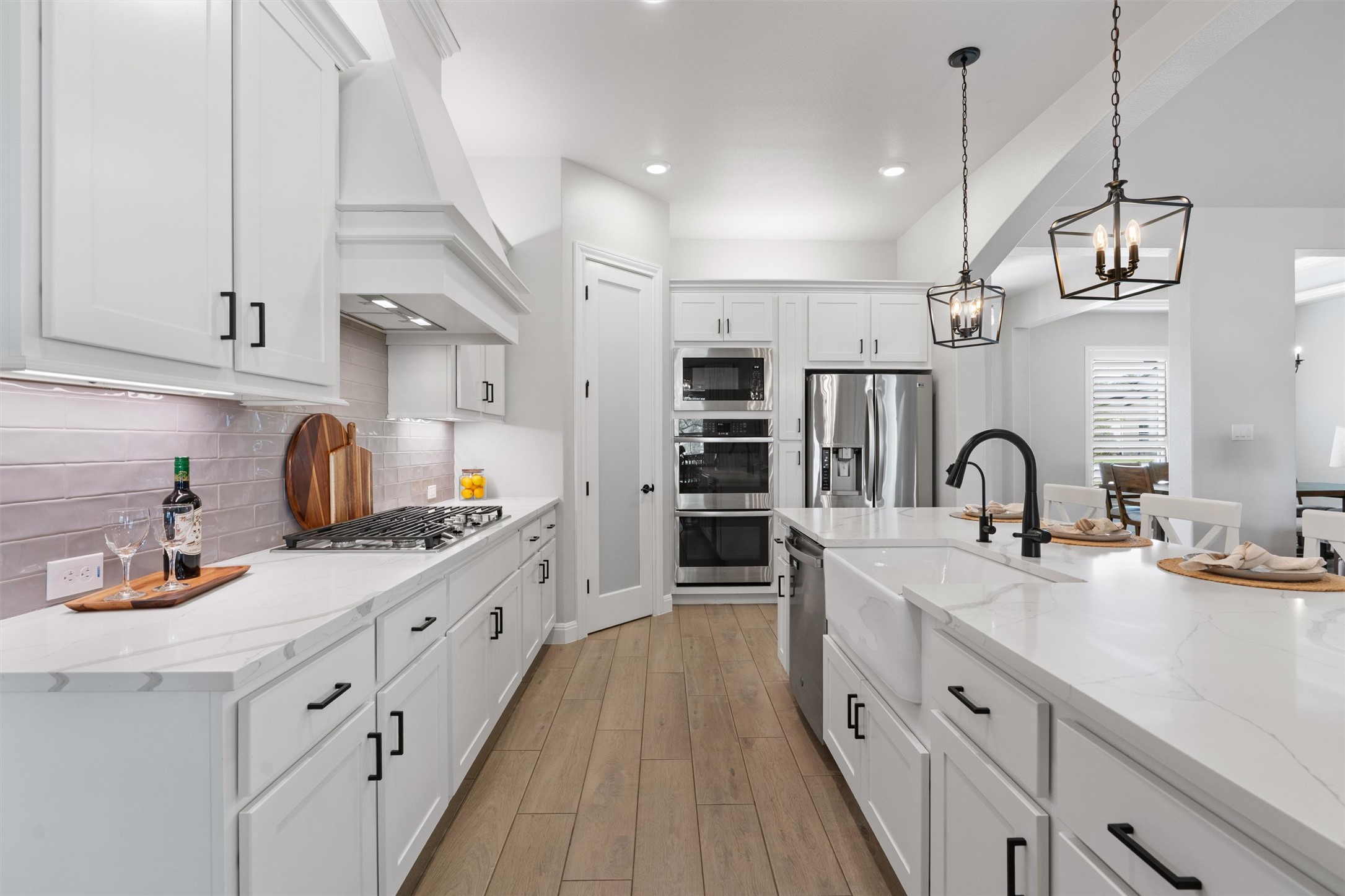 210 Miranda Way Georgetown, TX 78633 - Photo 12 of 40 The kitchen features pristine white cabinetry and opulent quartz counters.
