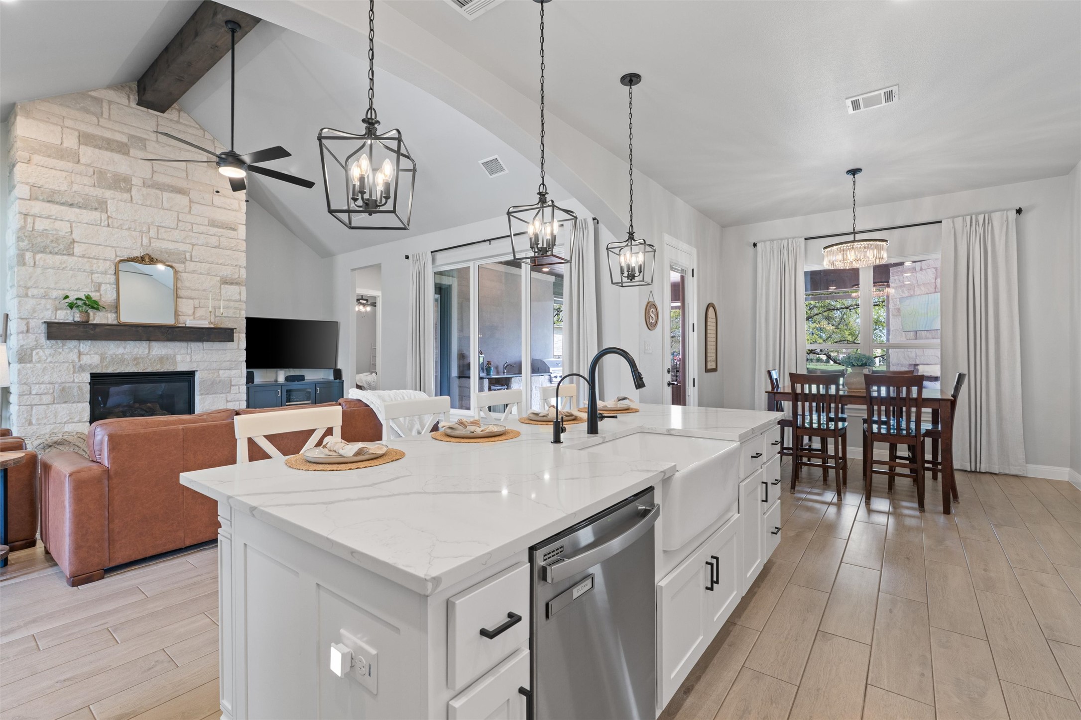 210 Miranda Way Georgetown, TX 78633 - Photo 13 of 40 A large island connects the kitchen to the living room and invites gathering and conversation with guests.