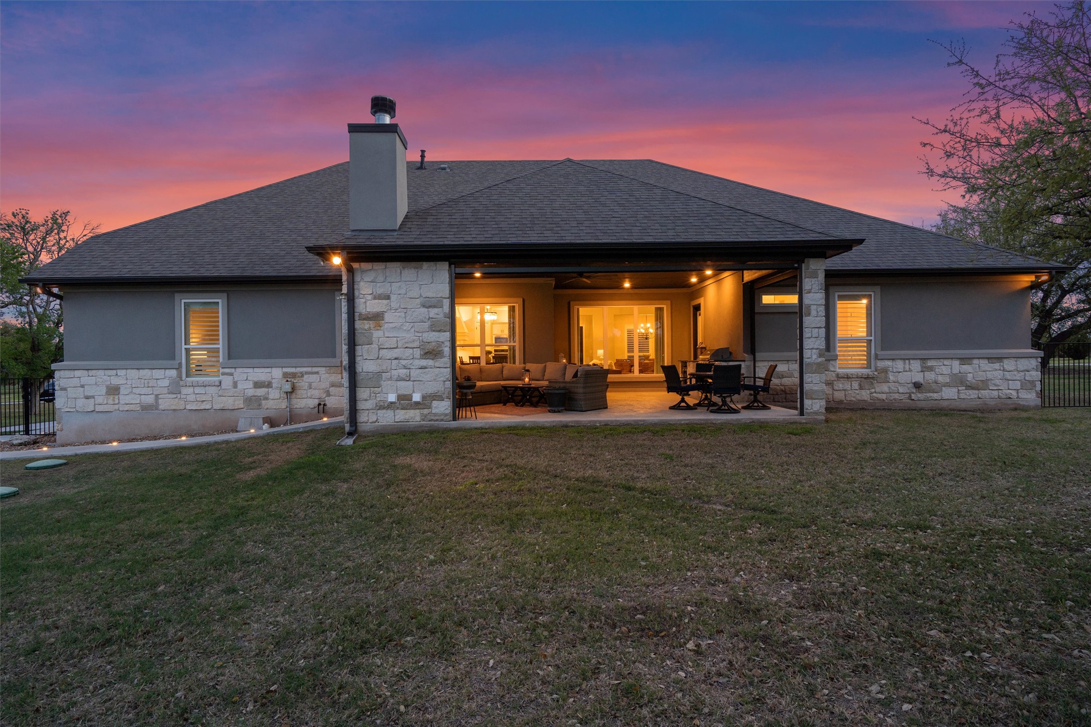 210 Miranda Way Georgetown, TX 78633 - Photo 34 of 40 The patio offers automatic retractable screens, providing flexibility for year-round enjoyment.