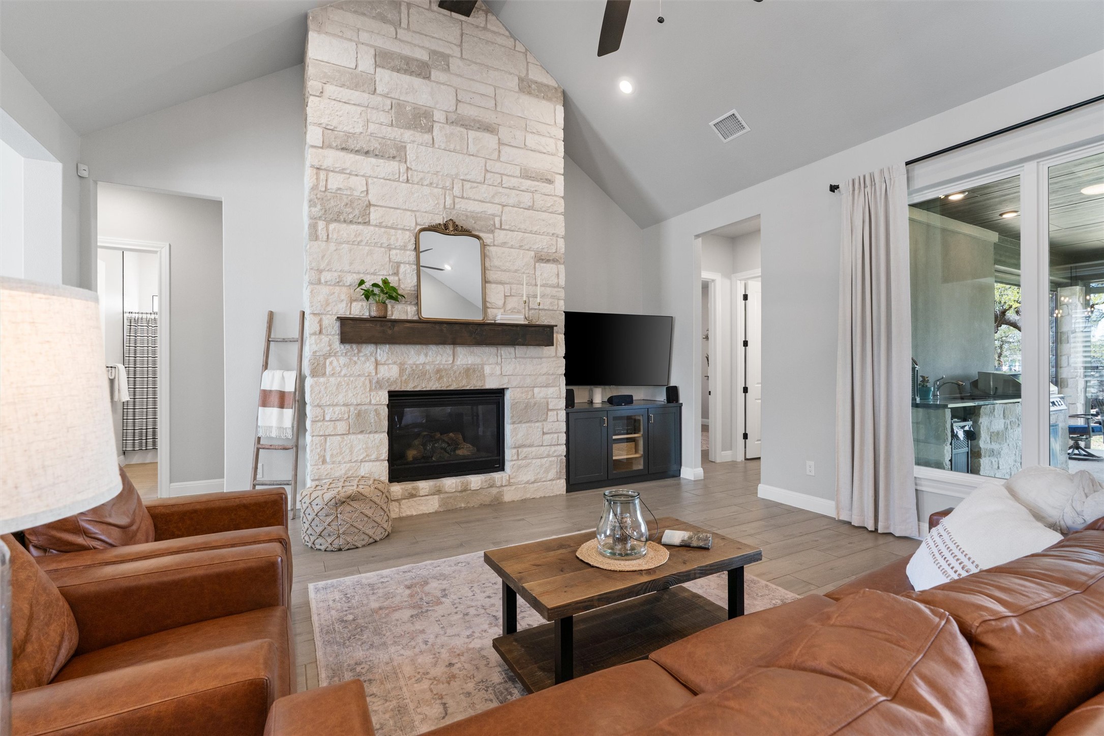 210 Miranda Way Georgetown, TX 78633 - Photo 8 of 40 A striking stone fireplace takes center stage.