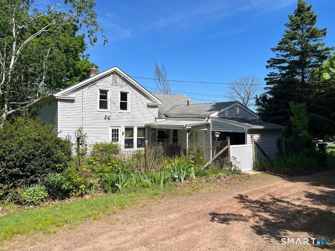 217 West Road Ellington, CT 06029 - Photo 2 of 2 a house view with a garden space