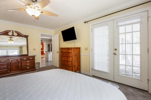 167 Edgewater Drive Temple, GA 30179 - Photo 19 of 37 a bedroom with furniture and a flat screen tv