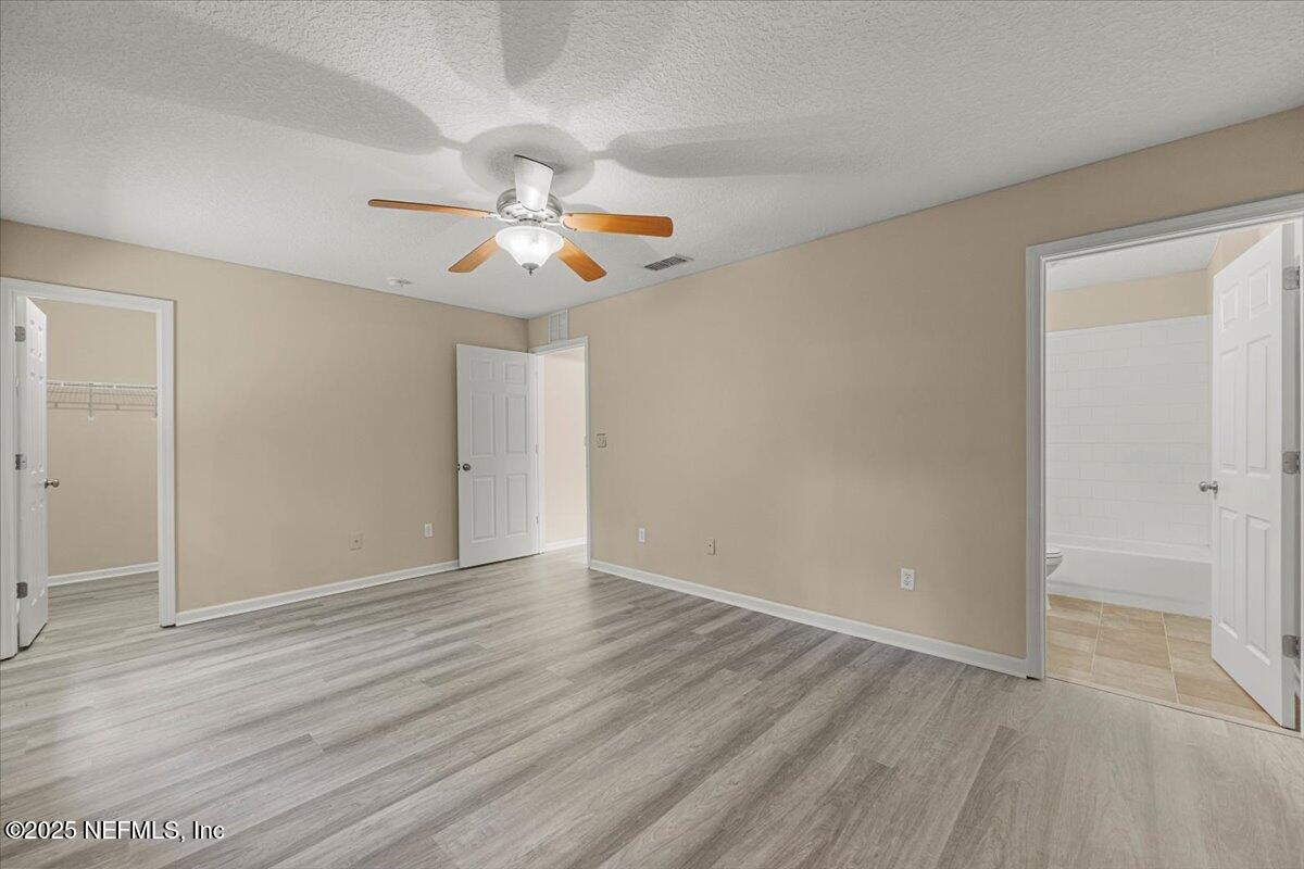 4527 Clairmont Road Jacksonville, FL 32207 - Photo 15 of 31 wooden floor in an empty room with a window