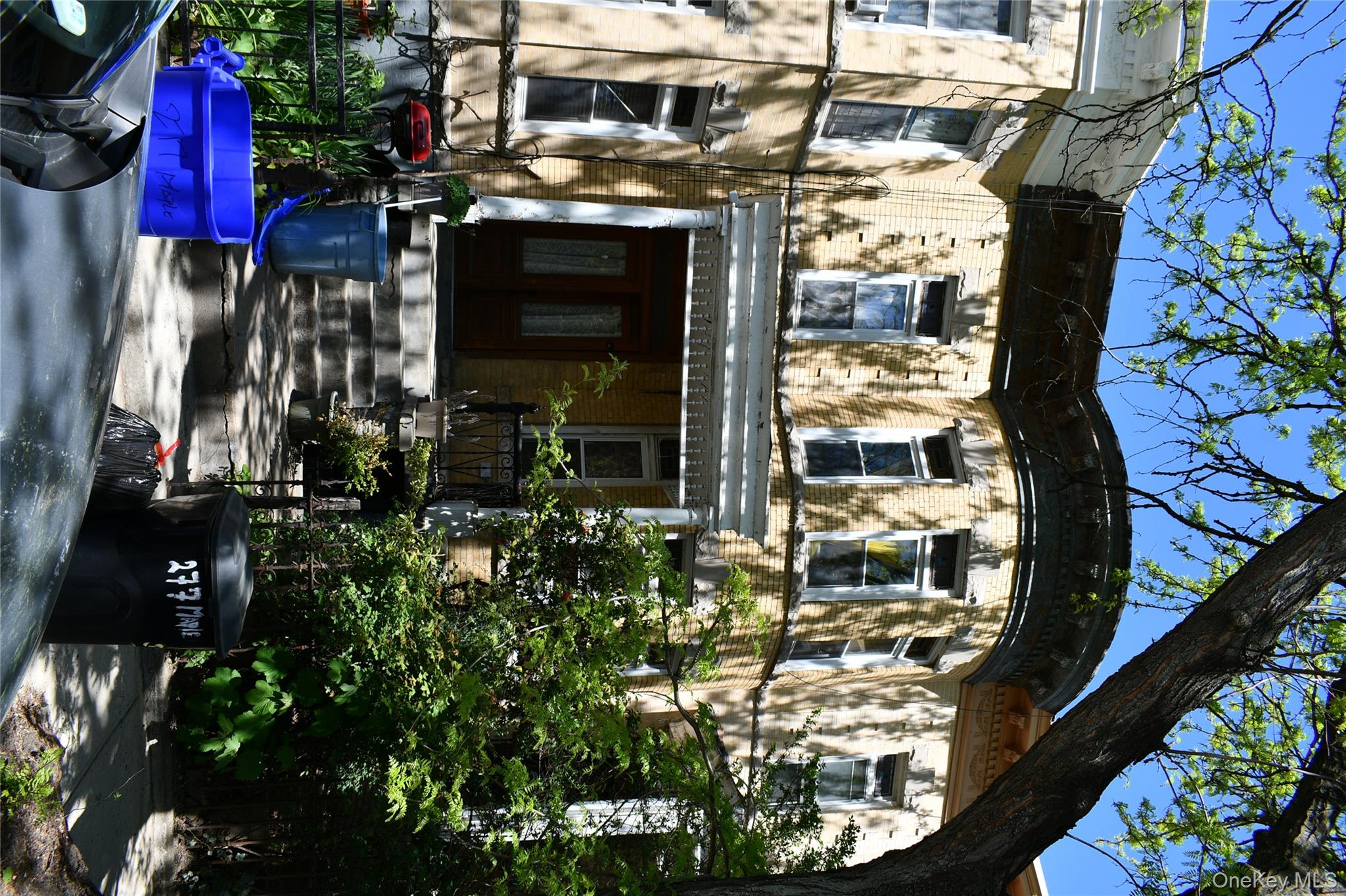 277 Maple Street Brooklyn, NY 11225 - Photo 4 of 5 a front view of a house with a yard