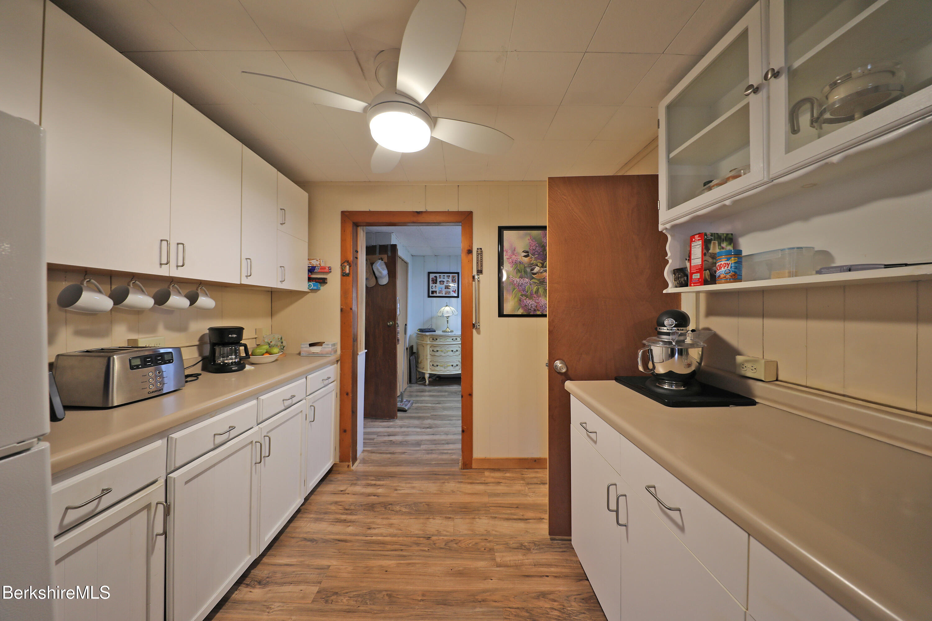 735 Cape Street Lee, MA 01238 - Photo 12 of 23 a kitchen with white cabinets and sink