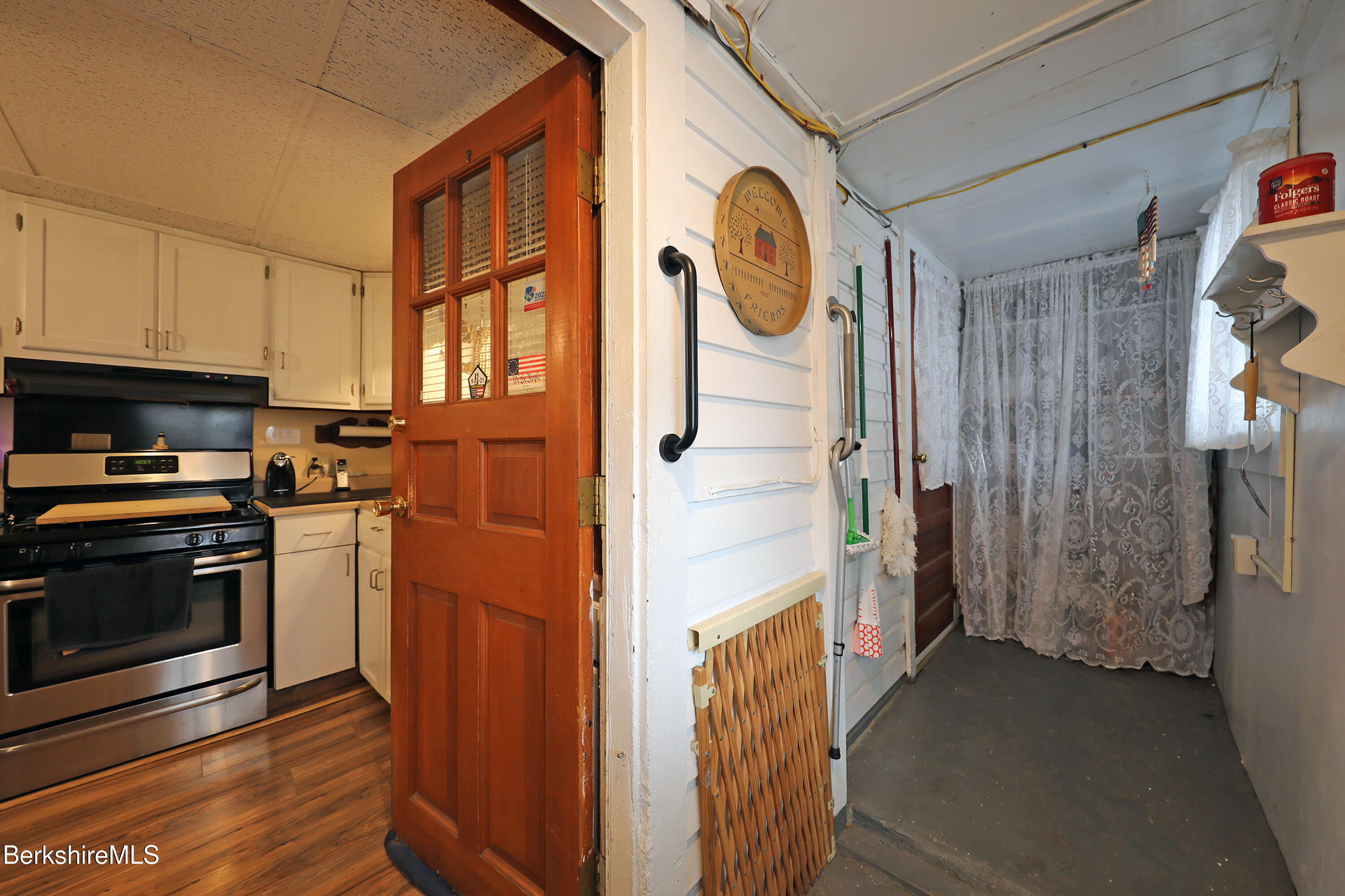 735 Cape Street Lee, MA 01238 - Photo 22 of 23 a kitchen with a refrigerator and a stove top oven
