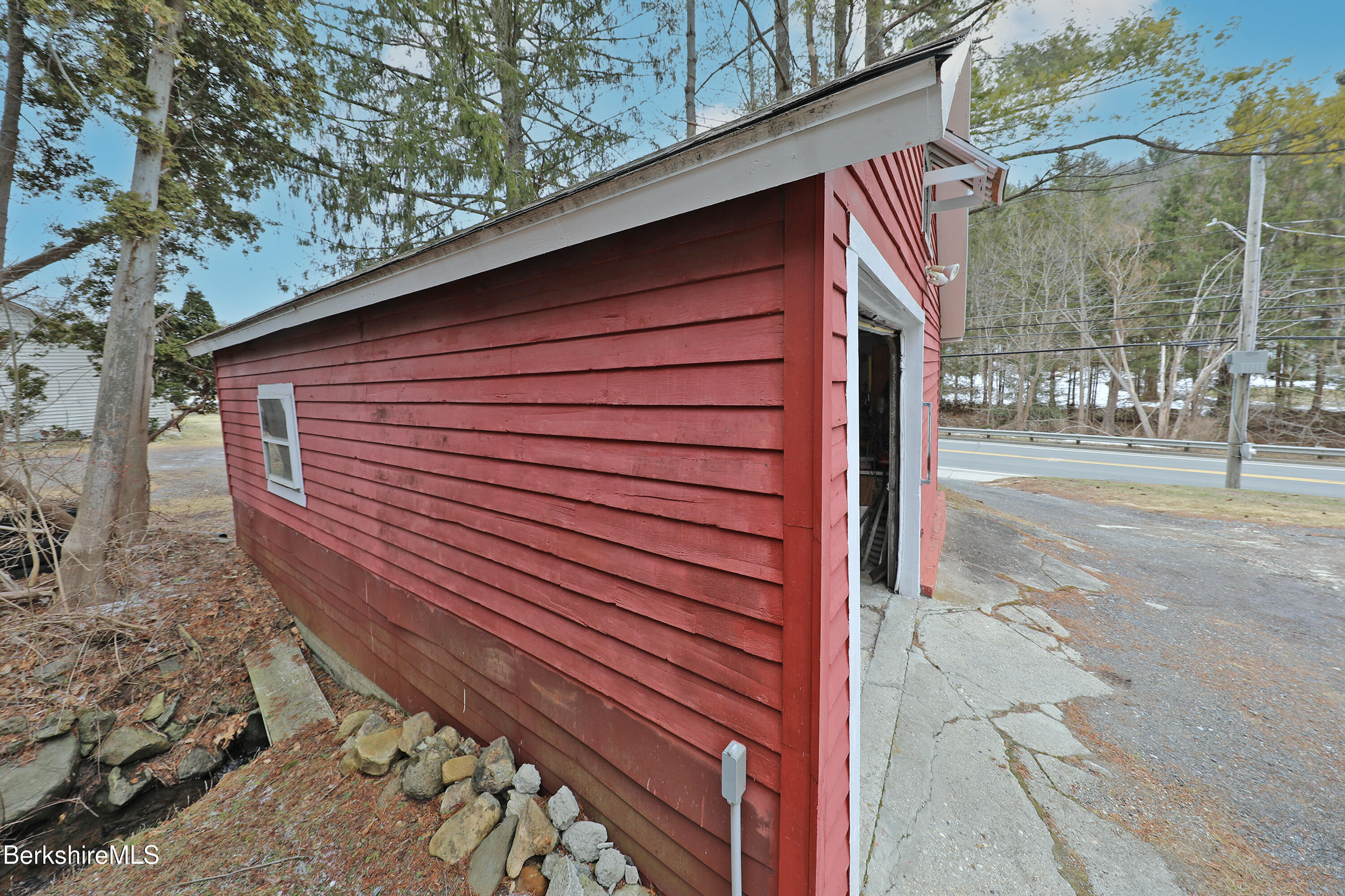 735 Cape Street Lee, MA 01238 - Photo 4 of 23 a view of a street with a brick wall