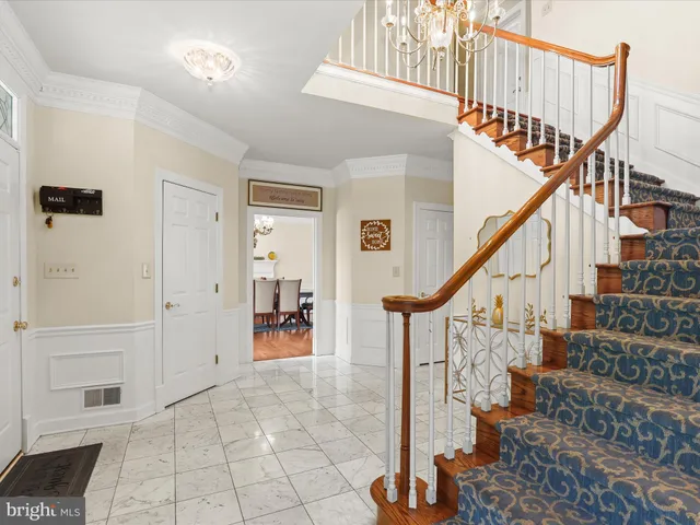 a kitchen with stainless steel appliances granite countertop a stove a sink dishwasher and a refrigerator