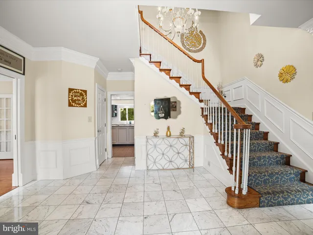 a kitchen with stainless steel appliances granite countertop a stove a sink dishwasher and a refrigerator