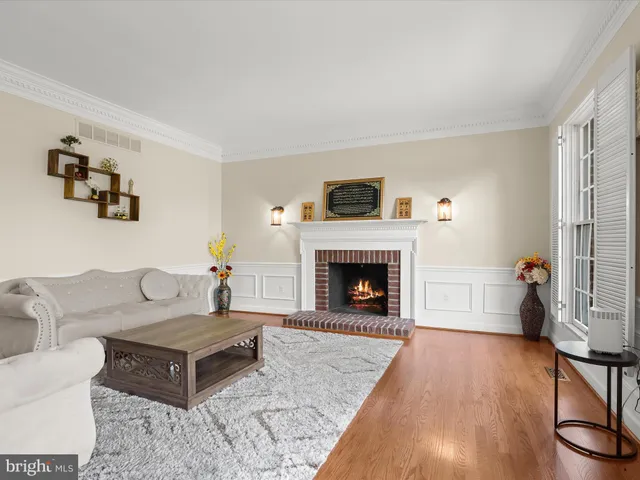 a view of a dining room with furniture large windows and wooden floor