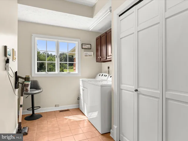 a view of a lake with a house in the background