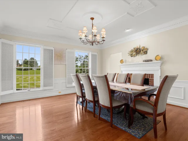 a living room with furniture a window and a fireplace