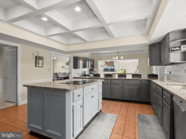 a living room with a fireplace a flat screen tv and a fireplace