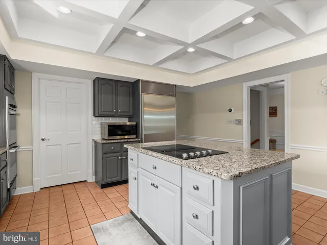 a living room with furniture wooden floor and a fireplace